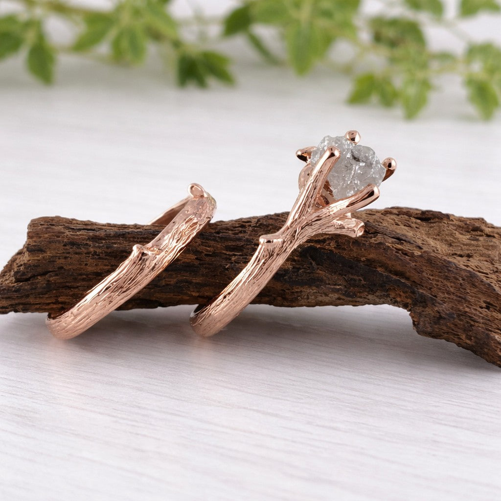 Rose gold ring with a diamond on a wooden branch