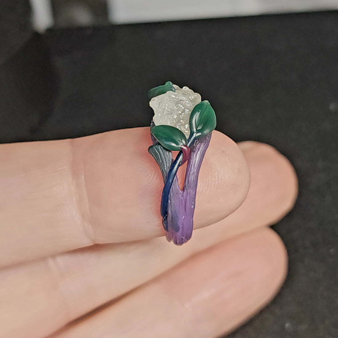 raw diamond ring in the stages of being made