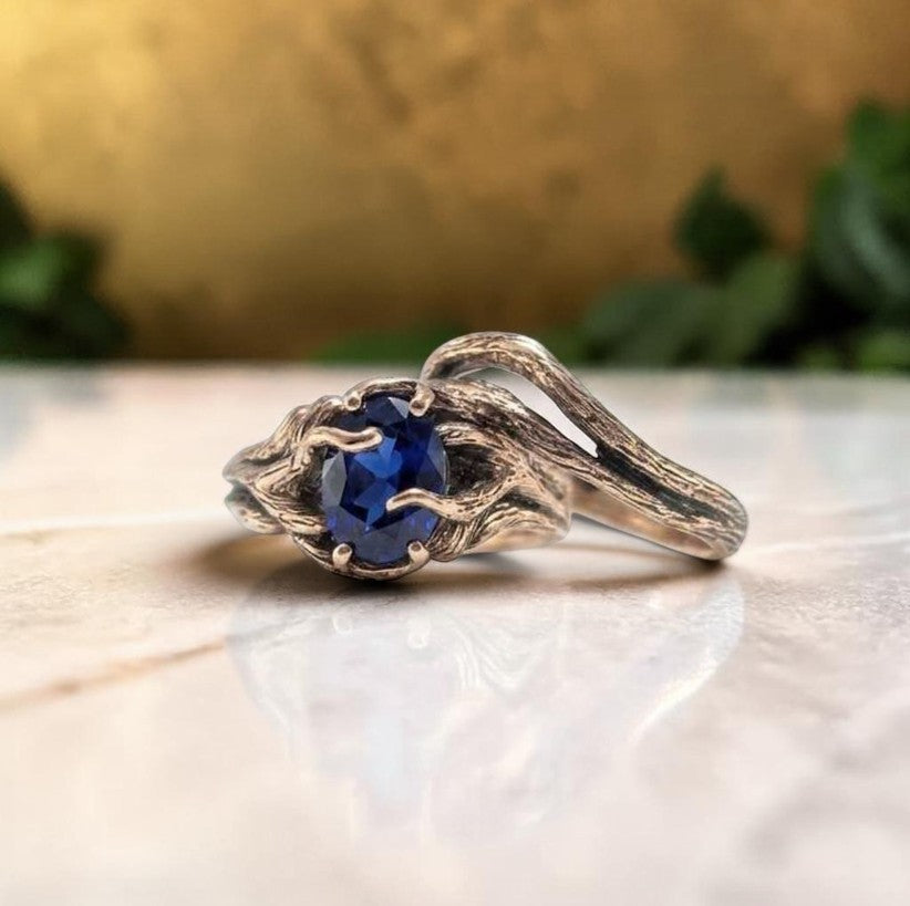 oval sapphire vine style ring in rose gold
