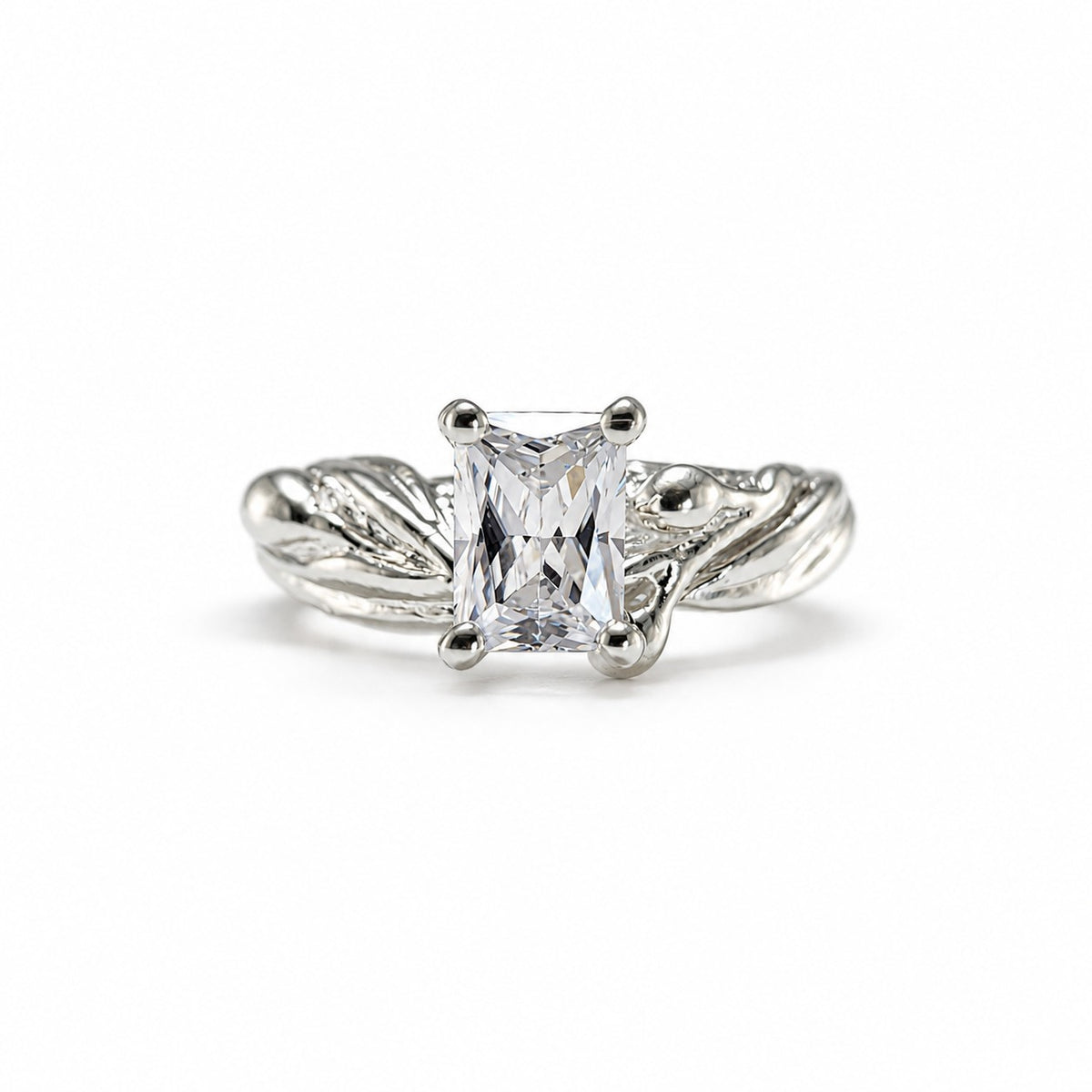 radiant cut moissanite diamond ring in a olive branch style ring setting